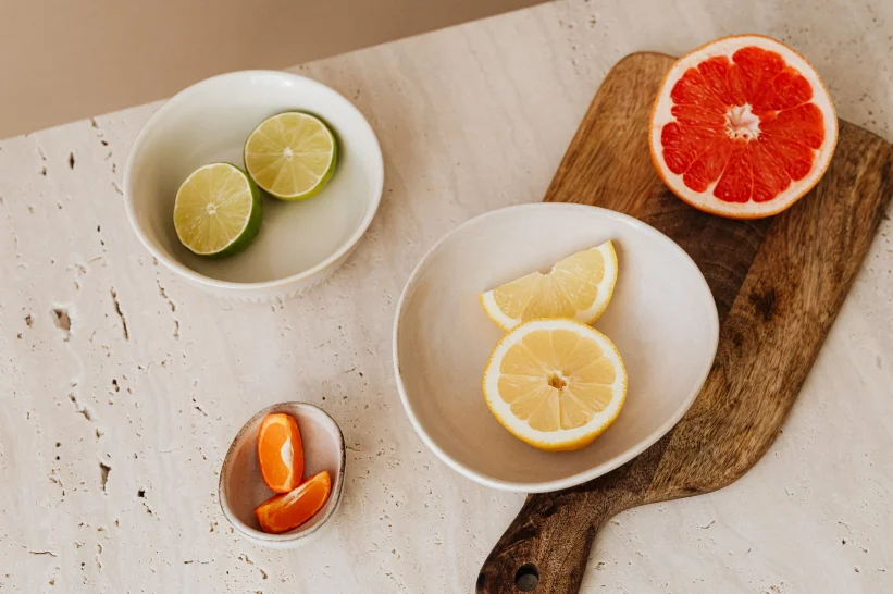 Lemon and grape fruit artfully arranged on a wooden table