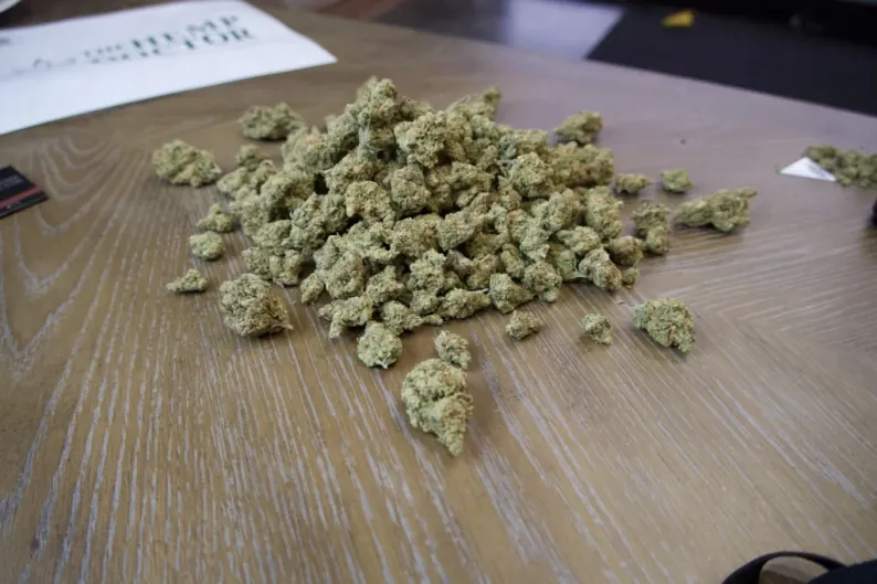 qp of weed flower on top of a wooden table